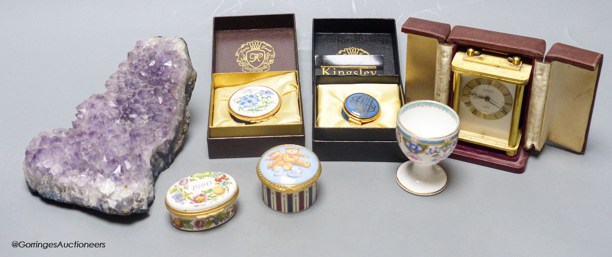 A small group of collectables including trinket boxes, a Mintons egg cup, a Lupin carriage timepiece and a piece of amethyst quartz
